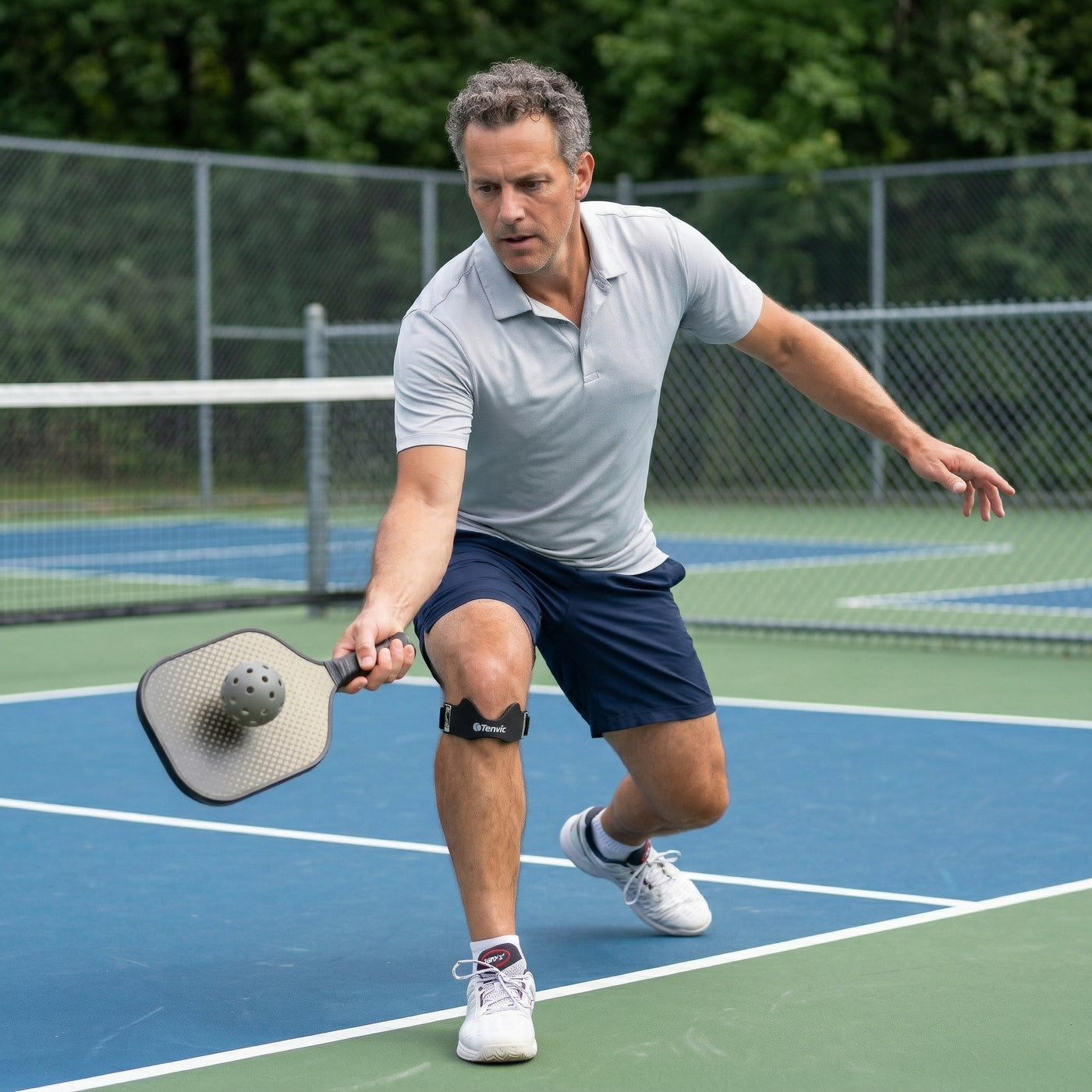 Pickleball player wearing an AirPad on court